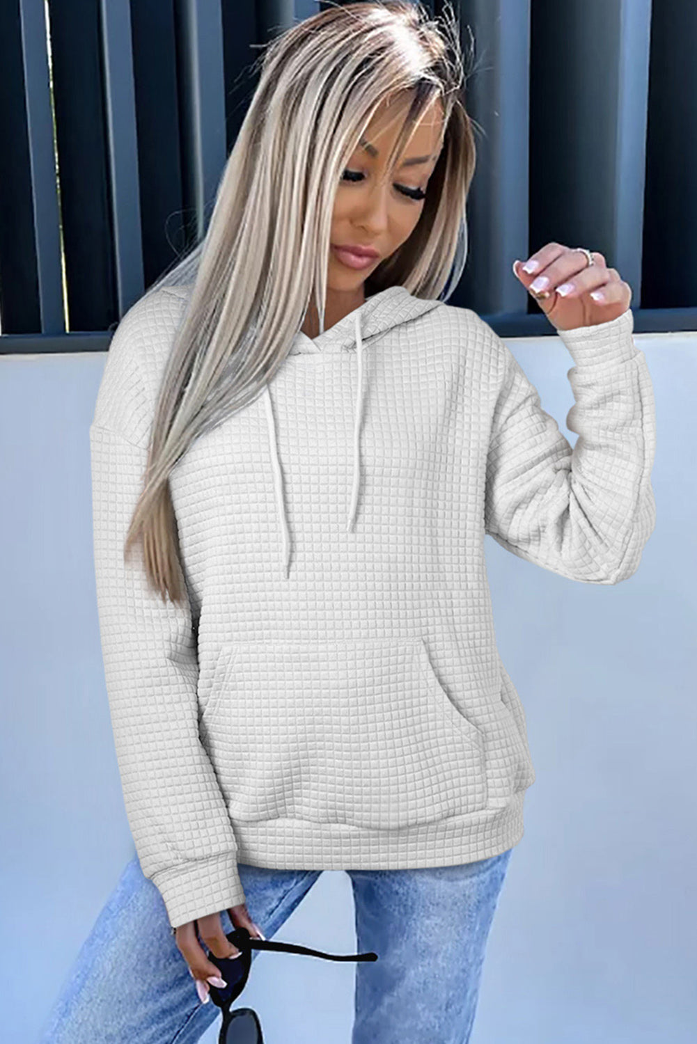 Expertly crafted with a textured white lattice design, this hoodie features a drawstring and kangaroo pocket for both style and convenience.