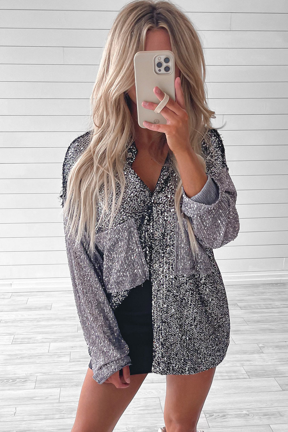 The Pyrite - Buttoned Blouse features a striking silver color block design adorned with eye-catching sequin accents and functional patch pockets.