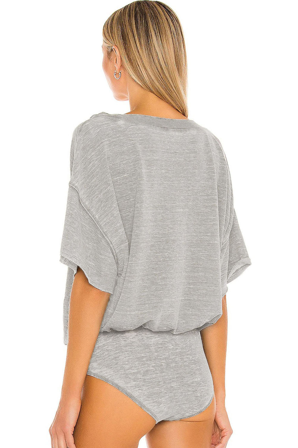 This bodysuit features an oversize, casual design with drop shoulders for a laid-back, yet stylish look.