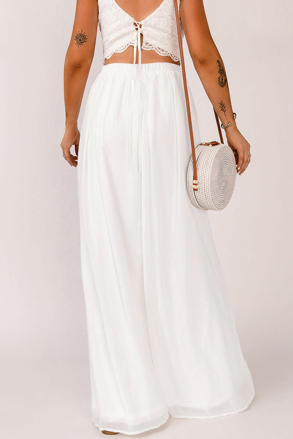 This maxi skirt features a unique split design and a high waist for a stylish and versatile look. Perfect for both cocktail and casual occasions.