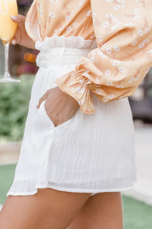 Constructed from high-quality, crinkle fabric, our Cottontail Belted Shorts feature an elastic waist and paperbag design for a comfortable, yet chic, casual look.