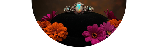 Antique Opal and Tourmaline jewelry displayed with marigold and cosmos wedding flowers — Demali&RiverCo.