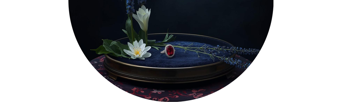 Antique Ruby fine jewelry displayed with Larkspur and Water Lily wedding flowers — Demali&RiverCo.