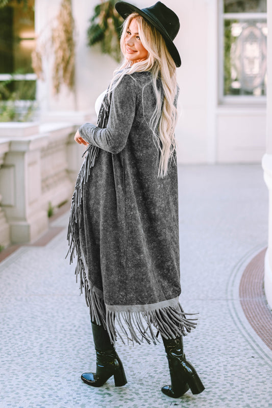 Attention all cardigan lovers! Get ready to rock your wardrobe with our Black Mineral - Cardigan. This open front, long cardigan features tassel accents and a unique washed design. Don't miss out on this quirky and playful addition to your collection.