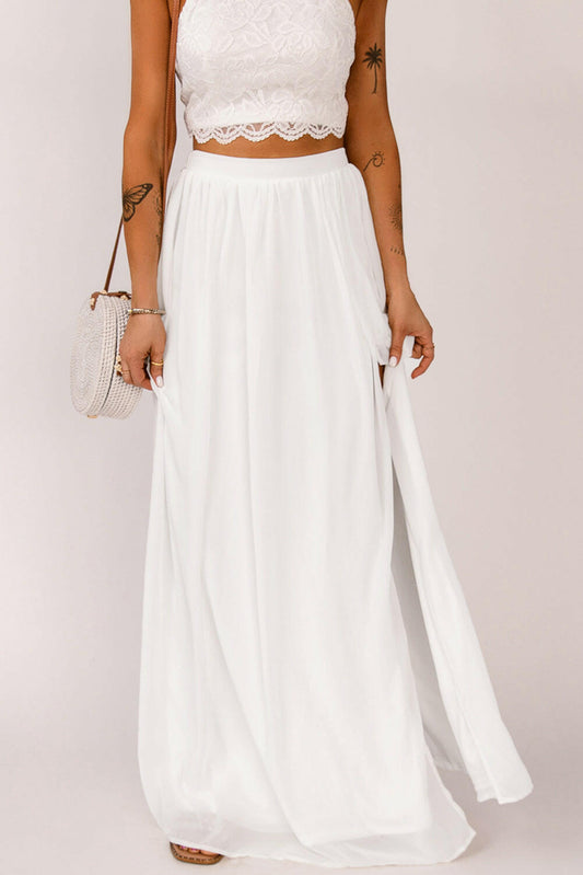 This maxi skirt features a unique split design and a high waist for a stylish and versatile look. Perfect for both cocktail and casual occasions.